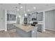 Modern kitchen with granite countertops, stainless steel appliances, tile backsplash, recessed lighting, and gray cabinetry at 3224 Pearly Dr, Lakeland, FL 33812