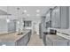 Well-lit kitchen with stainless appliances, gray cabinets, granite counters, tile backsplash, and recessed lighting at 3224 Pearly Dr, Lakeland, FL 33812