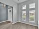 Bright, neutral-toned living room with tall windows and modern decor at 3224 Pearly Dr, Lakeland, FL 33812