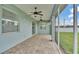 A covered patio with ceiling fans and a view of the fenced yard at 3224 Pearly Dr, Lakeland, FL 33812