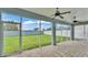 Covered patio with tile floor, ceiling fans, and view of fenced backyard at 3224 Pearly Dr, Lakeland, FL 33812