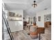 Open dining area with unique barrel table, stylish seating, and seamless connection to living space at 3328 Imperial Ln, Lakeland, FL 33812