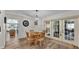 Inviting dining room featuring a round table, seating for four, and sliding glass doors leading to the outdoors at 3328 Imperial Ln, Lakeland, FL 33812