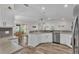 Bright, updated kitchen featuring white cabinetry, modern appliances, and seamless access to dining area at 3328 Imperial Ln, Lakeland, FL 33812