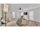 Airy main bedroom features a ceiling fan, TV, and a sitting area near the bright windows at 3328 Imperial Ln, Lakeland, FL 33812