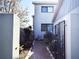 A brick pathway winds through a private, gated courtyard to the home's entrance at 3350 Kilmer Dr, Lakeland, FL 33803