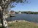 Enjoy the lake view from your property with the dock, perfect for fishing and boating at 3350 Kilmer Dr, Lakeland, FL 33803