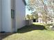 Exterior side view of home, highlighting its architectural details and surrounding landscape at 3350 Kilmer Dr, Lakeland, FL 33803