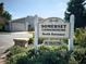 Community entrance sign surrounded by lush landscaping welcomes residents and guests at 3350 Kilmer Dr, Lakeland, FL 33803