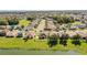 Wide aerial view showing the property's backyard facing a large pond within a quiet residential neighborhood at 3882 Rollingsford Cir, Lakeland, FL 33810