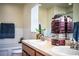 Bright bathroom featuring double sinks with ample counter space and natural light at 3882 Rollingsford Cir, Lakeland, FL 33810