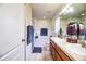 Bright bathroom with double sinks, a bathtub, and a shower featuring ample counter space at 3882 Rollingsford Cir, Lakeland, FL 33810