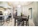 The eat-in kitchen and dining area offers a pendant lighting fixture and access to kitchen at 3882 Rollingsford Cir, Lakeland, FL 33810