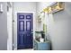 Bright hallway with unique decor details and a stylish blue front door at 3882 Rollingsford Cir, Lakeland, FL 33810