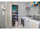 Functional laundry room with modern appliances and ample storage space at 3882 Rollingsford Cir, Lakeland, FL 33810