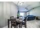 The dining area leads into the living room with high ceilings and sliding glass door to lanai at 3882 Rollingsford Cir, Lakeland, FL 33810