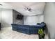 Comfortable living room featuring sleek marble flooring, a ceiling fan, and a decorative fireplace at 3882 Rollingsford Cir, Lakeland, FL 33810