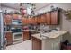 Well-equipped kitchen with stainless steel appliances, granite countertops, and custom cabinetry at 4010 Winding Vine Dr # 4010, Lakeland, FL 33812