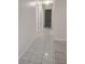 Hallway featuring tile flooring leads to various rooms at 406 Fox Lake Dr, Lakeland, FL 33809