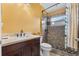 Updated bathroom featuring a tiled shower with glass door, stylish fixtures, and modern design at 4688 Hickory Stream Ln, Mulberry, FL 33860