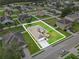 Aerial view of a single-Gathering home featuring a manicured lawn and an attached two-car garage at 4688 Hickory Stream Ln, Mulberry, FL 33860