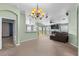 Spacious living room featuring neutral carpet, and an open floorplan leading to the patio at 4688 Hickory Stream Ln, Mulberry, FL 33860