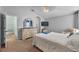 Inviting main bedroom featuring carpet flooring, neutral paint, and a large window at 4688 Hickory Stream Ln, Mulberry, FL 33860