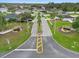 Aerial street view showcases manicured landscaping and signage at the Creekside community entrance at 4688 Hickory Stream Ln, Mulberry, FL 33860