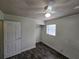 Bedroom features a ceiling fan, a window, and a built-in closet for added storage and convenience at 475 W Ethelene St, Bartow, FL 33830