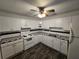 Bright kitchen with white cabinets, black and white checkered countertops, and modern appliances at 475 W Ethelene St, Bartow, FL 33830