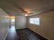 Inviting living room with hardwood floors, large windows, and neutral wall color palette at 475 W Ethelene St, Bartow, FL 33830