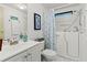 Bright bathroom features a walk-in tub with a shower and modern fixtures at 4911 Colonnades Club Blvd, Lakeland, FL 33811