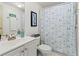 Bathroom with a vanity, sink, and a shower with nautical themed curtain at 4911 Colonnades Club Blvd, Lakeland, FL 33811