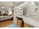 Bathroom vanity with large mirrors next to the primary bedroom at 4911 Colonnades Club Blvd, Lakeland, FL 33811