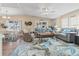 Inviting living room with plush seating, decorative rug, and plenty of natural light at 4911 Colonnades Club Blvd, Lakeland, FL 33811