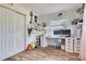 This bedroom features wood flooring, a window, a closet and an oversized desk at 507 8Th Se St, Fort Meade, FL 33841