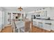 Bright dining area transitions seamlessly to the kitchen featuring a stylish bar and open floorplan at 511 Mcrorie St, Lakeland, FL 33803