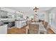 Inviting dining area with wicker chairs and a view into the stylish kitchen and living spaces at 511 Mcrorie St, Lakeland, FL 33803