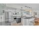 Modern kitchen featuring sleek countertops, stainless steel appliances, and a breakfast bar at 511 Mcrorie St, Lakeland, FL 33803