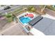 Aerial view of a pool and patio featuring outdoor seating and a privacy fence at 511 Mcrorie St, Lakeland, FL 33803