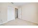 Carpeted room with a double-door closet and doorway leading to another room at 5377 Quarry Rock Rd, Lakeland, FL 33809