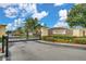 View of the neighborhood entrance with manicured landscaping and automatic gate at 5377 Quarry Rock Rd, Lakeland, FL 33809