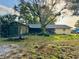 Expansive backyard featuring a trampoline and mature trees at 5422 Oakway Dr, Lakeland, FL 33805