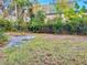 Large backyard with mature trees and ample space for outdoor activities at 5422 Oakway Dr, Lakeland, FL 33805