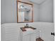 Stylish half bath with shiplap walls, wood countertop, and modern fixtures at 5435 Myrtle Hill W Dr, Lakeland, FL 33811