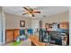 Bedroom with a desk area and a ceiling fan at 5435 Myrtle Hill W Dr, Lakeland, FL 33811