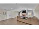 Inviting living room featuring cozy fireplace, wood flooring and plenty of natural light at 5435 Myrtle Hill W Dr, Lakeland, FL 33811