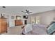 Spacious main bedroom with dresser, tv, and sliding doors to the back patio at 5435 Myrtle Hill W Dr, Lakeland, FL 33811