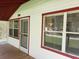 Close up on the front of the home featuring the porch, windows, and front door at 5515 3Rd Se St, Lakeland, FL 33812