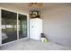 Outdoor patio area with a ceiling fan, a TV, a white refrigerator and room for seating at 554 Lorient Dr, Eagle Lake, FL 33839